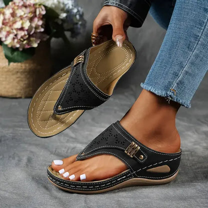 Women's T-strap slip-on comfort sandal in black, blue, bordeaux and brown