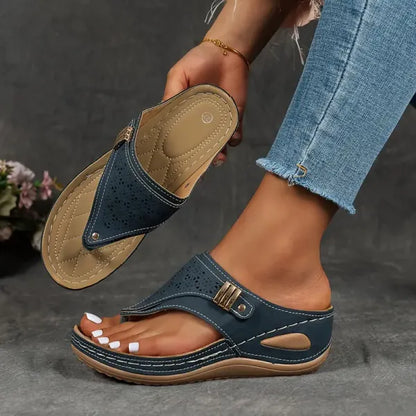 Women's T-strap slip-on comfort sandal in black, blue, bordeaux and brown