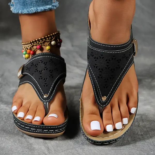 Women's T-strap slip-on comfort sandal in black, blue, bordeaux and brown