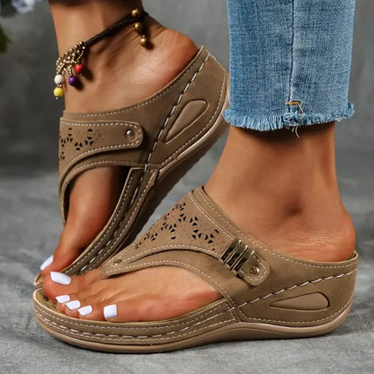 Women's T-strap slip-on comfort sandal in black, blue, bordeaux and brown
