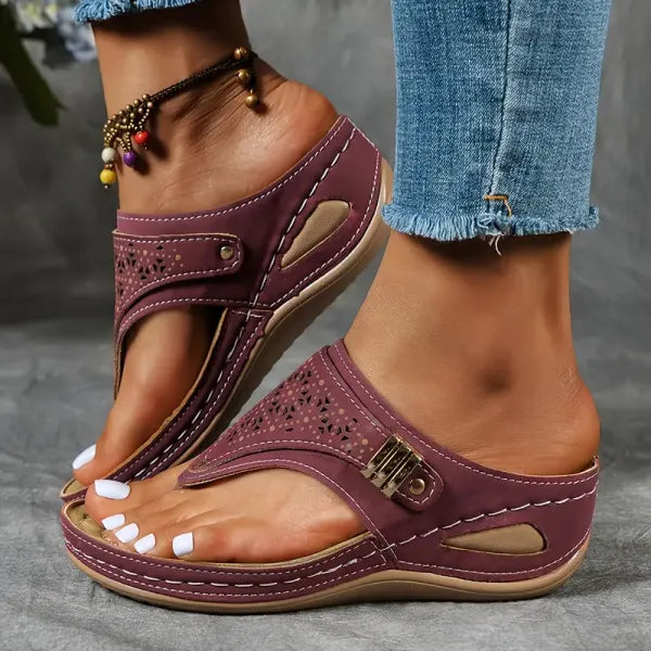 Women's T-strap slip-on comfort sandal in black, blue, bordeaux and brown
