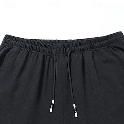 Men's relaxed straight-leg drawstring pants in light grey, black and navy, back view