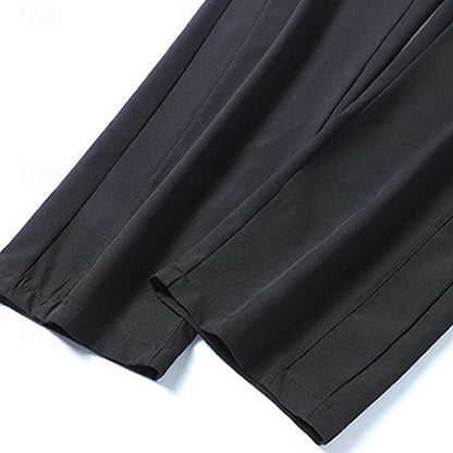 Men's relaxed straight-leg drawstring pants in light grey, black and navy, styled view
